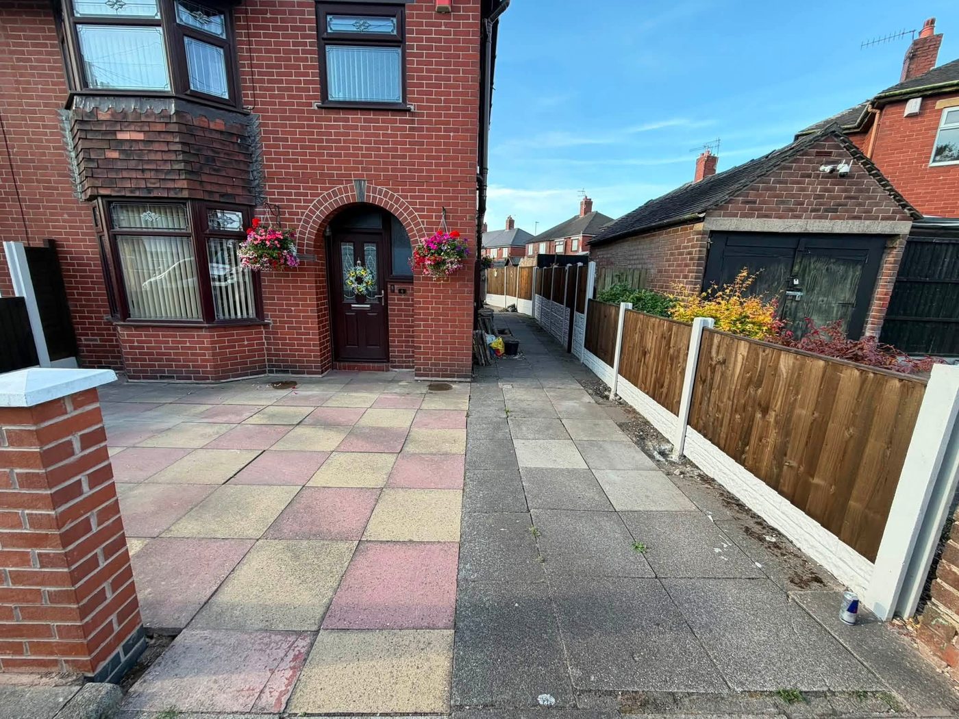 Cracked coloured slabs on a driveway before the block paving went down