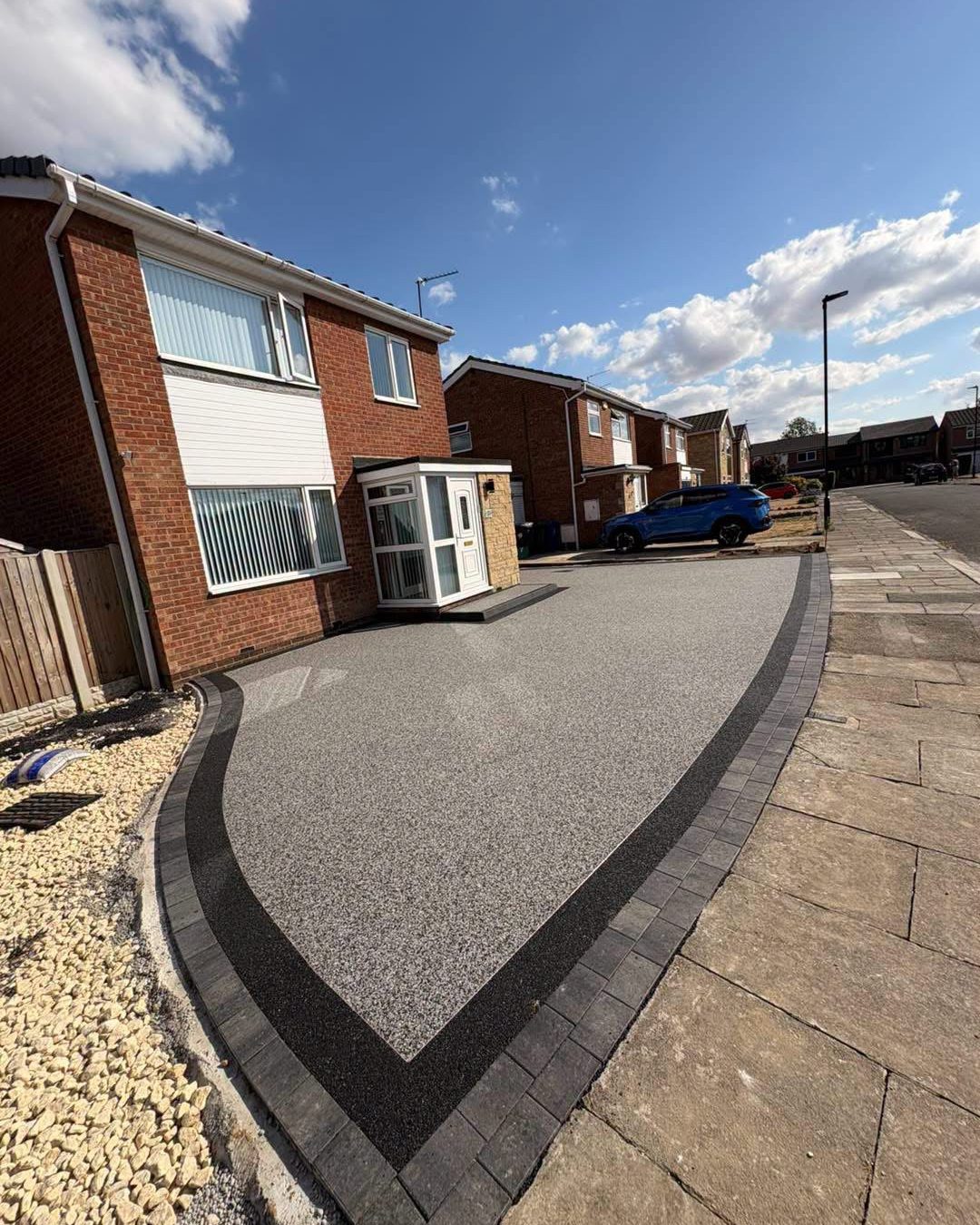 Grey resin bound driveway with a charcoal border, Rightway project near Borough, Yeovil BA20