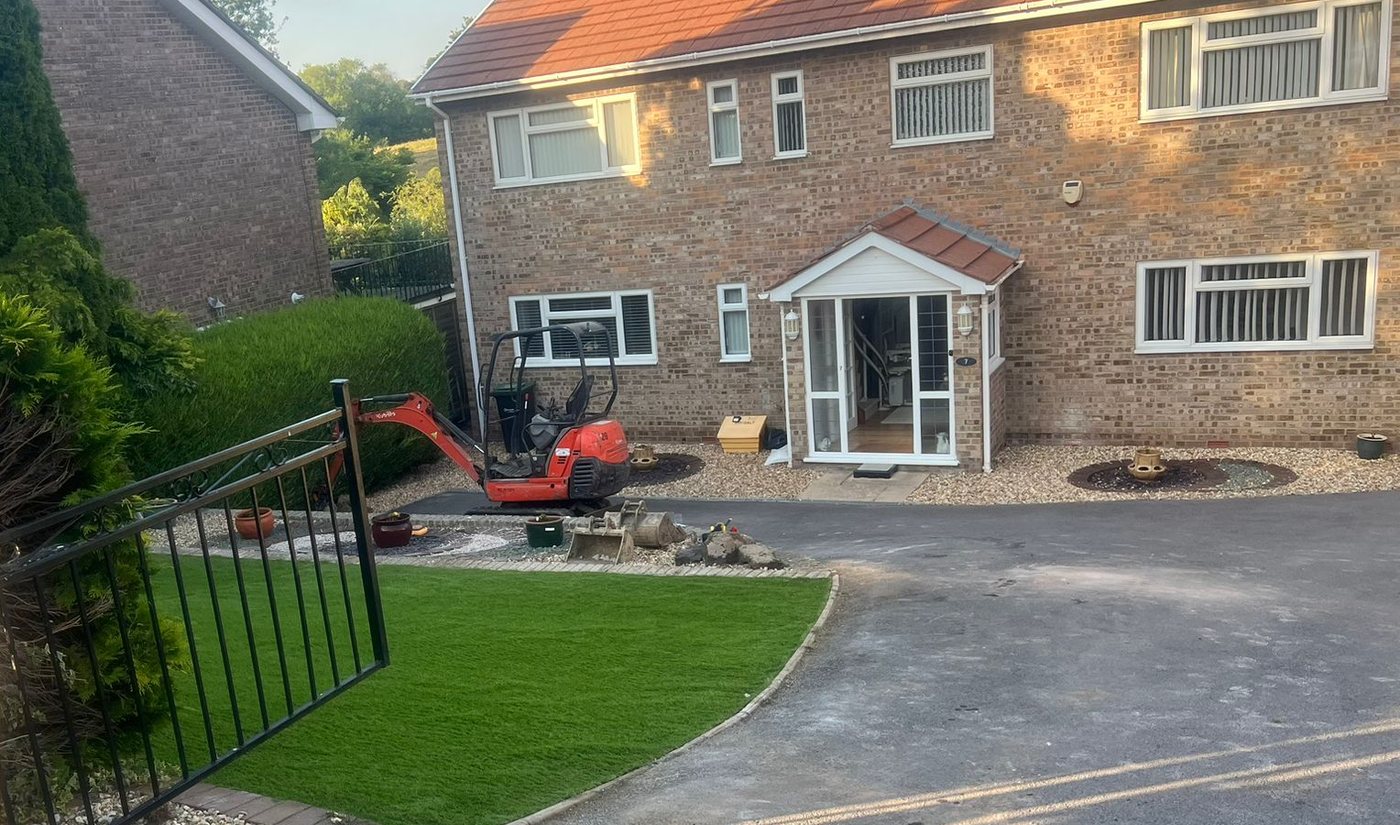 Artificial lawn laid to a curved edge beside a tarmac drive, Rightway, Salisbury